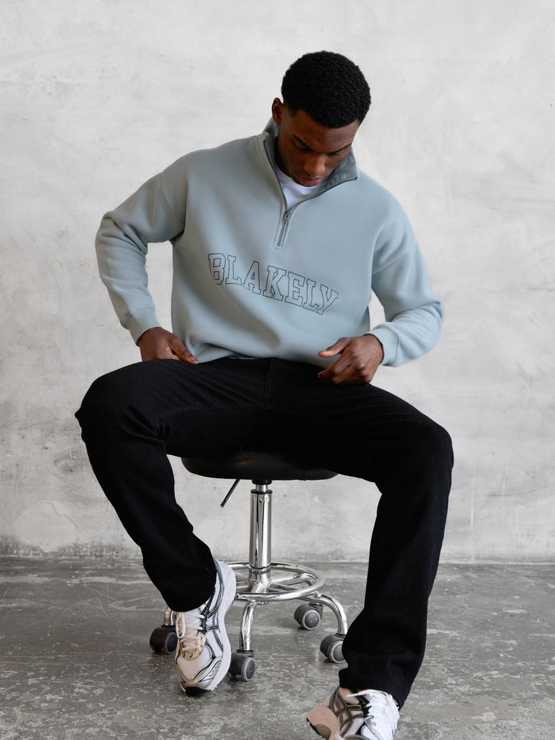 Outline Varsity 1/4 Zip Up Jumper - Mineralblau