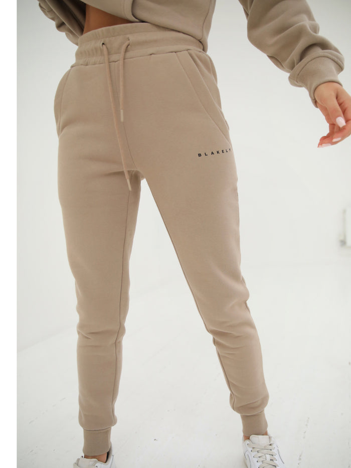  ANDRE Spring Fashion for Women 2023 Exercise Running Polyester  Joggers Slacks for Women Breathable Loose Solid Color Stretchy Waist Cinch  Bottom Sweatpants(Beige,Small) : Clothing, Shoes & Jewelry